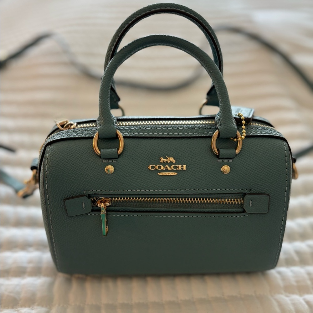 Mini coach purse. Brand new never used. Bought for an event that got canceled